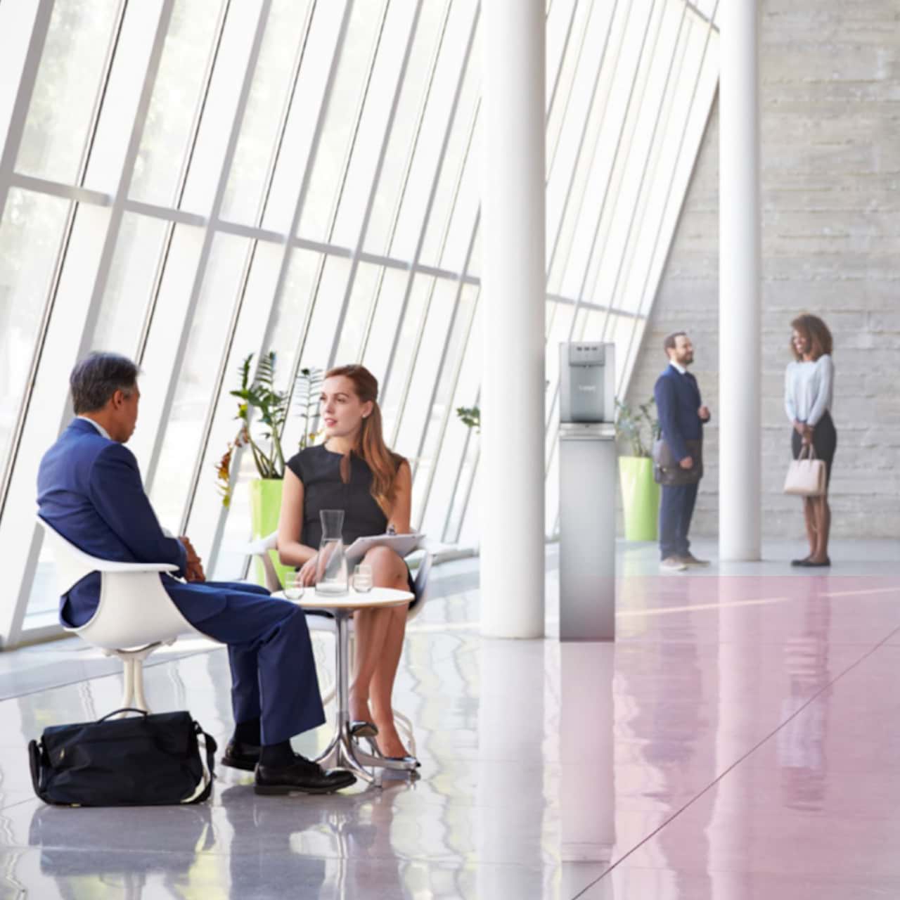 Offices with 4 persons having conversation